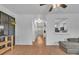 Open living room with hardwood floors, a view of the kitchen, and a cozy couch at 1506 Knights Trl, Stone Mountain, GA 30083