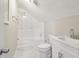 A modern bathroom with a shower-tub combo and a sleek vanity sink at 1563 Mayflower Sw Ave, Atlanta, GA 30311