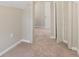 View of hallway and another bedroom showing wall-to-wall carpeting and fresh paint at 1563 Mayflower Sw Ave, Atlanta, GA 30311