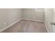 A cozy bedroom featuring wall-to-wall carpet and a window at 1563 Mayflower Sw Ave, Atlanta, GA 30311