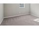 A bedroom featuring wall-to-wall carpeting and a single window that offers natural light at 1563 Mayflower Sw Ave, Atlanta, GA 30311