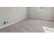Bedroom features a window providing natural light and wall-to-wall carpeting at 1563 Mayflower Sw Ave, Atlanta, GA 30311