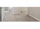 A clean hallway with neutral carpet and a series of doors along the hall at 1563 Mayflower Sw Ave, Atlanta, GA 30311