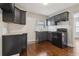 Modern kitchen with black cabinets, subway tile backsplash, and granite countertops at 1563 Mayflower Sw Ave, Atlanta, GA 30311