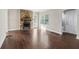 Spacious living room showcases a stone fireplace and beautiful hardwood floors at 1563 Mayflower Sw Ave, Atlanta, GA 30311