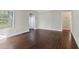 Inviting living room featuring gleaming hardwood floors, neutral wall paint, and natural light at 1563 Mayflower Sw Ave, Atlanta, GA 30311
