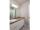 Bathroom with granite countertop, vanity and sink with gray tile floor at 1814 Oak Branch Way, Loganville, GA 30052