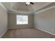 Bright bedroom features neutral walls and carpet, and bright windows at 1814 Oak Branch Way, Loganville, GA 30052
