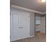 Spacious carpeted bedroom featuring large closet and neutral paint, making it move-in ready at 1814 Oak Branch Way, Loganville, GA 30052