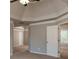 Large bedroom featuring neutral walls, plush carpet, bright windows and tray ceiling at 1814 Oak Branch Way, Loganville, GA 30052