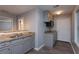 Kitchen featuring gray cabinets, granite countertops and wood floors at 1814 Oak Branch Way, Loganville, GA 30052