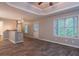 Living room with wood floors, windows and bar, perfect for entertaining at 1814 Oak Branch Way, Loganville, GA 30052