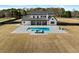 Backyard showcasing a modern farmhouse, pool, spa, and a spacious lawn at 2485 Brooks Rd, Dacula, GA 30019