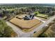 Aerial view of a modern farmhouse on a large lot featuring a private yard with pool and outdoor amenities at 2485 Brooks Rd, Dacula, GA 30019