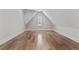 Cozy attic space with hardwood floors and a window at 2485 Brooks Rd, Dacula, GA 30019
