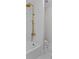 Bright bathroom features a golden rainfall shower head and marble tile flooring at 2485 Brooks Rd, Dacula, GA 30019
