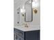 Elegant bathroom vanity with granite countertop, modern fixtures, and ample storage at 2485 Brooks Rd, Dacula, GA 30019