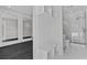 View of the bathroom featuring modern finishes, glass shower, and built-in storage at 2485 Brooks Rd, Dacula, GA 30019