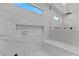 Luxurious bathroom with a large shower featuring marble-like tile and a built-in bench at 2485 Brooks Rd, Dacula, GA 30019