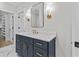Elegant bathroom vanity with granite countertop, modern fixtures, and ample storage at 2485 Brooks Rd, Dacula, GA 30019
