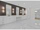 Luxurious primary bathroom with dual vanities, decorative mirrors, and stylish lighting fixtures at 2485 Brooks Rd, Dacula, GA 30019