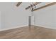 Bedroom with high ceilings, wood beams, and a statement chandelier that adds warmth at 2485 Brooks Rd, Dacula, GA 30019