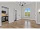 Bright bedroom with hardwood floors and access to a well-equipped wet bar for added convenience at 2485 Brooks Rd, Dacula, GA 30019