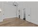Spacious bedroom with hardwood floors, large windows, and multiple doorways for easy access at 2485 Brooks Rd, Dacula, GA 30019