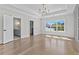 Spacious bedroom featuring tray ceilings, and an elegant chandelier that enhances the rooms appeal at 2485 Brooks Rd, Dacula, GA 30019