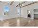 Bright bedroom with high ceilings, wood beams, and a view to the bathroom and closet at 2485 Brooks Rd, Dacula, GA 30019