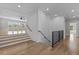 Bright foyer with stairs, hardwood floors, and recessed lighting creating a welcoming entrance at 2485 Brooks Rd, Dacula, GA 30019
