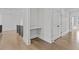 Hallway with hardwood floors and a built-in nook at 2485 Brooks Rd, Dacula, GA 30019