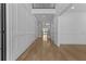 Elegant entry hall with hardwood floors and decorative wall paneling at 2485 Brooks Rd, Dacula, GA 30019