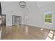Bright living room featuring high ceilings, large windows, hardwood floors, and elegant French doors at 2485 Brooks Rd, Dacula, GA 30019