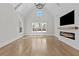 Bright living room features vaulted ceilings, recessed lighting, and a sleek, modern fireplace at 2485 Brooks Rd, Dacula, GA 30019