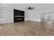 Spacious living room features hardwood floors, recessed lighting, a fireplace, and stylish built-ins at 2485 Brooks Rd, Dacula, GA 30019