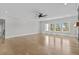 Bright and airy living room with large windows and beautiful hardwood flooring at 2485 Brooks Rd, Dacula, GA 30019