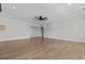 Open-concept living room with hardwood floors, recessed lighting, and smooth grey walls at 2485 Brooks Rd, Dacula, GA 30019