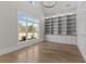 A brightly lit office space boasting built-in bookshelves and large windows at 2485 Brooks Rd, Dacula, GA 30019