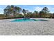 Outdoor pool with water feature and paver surround with a privacy fence and trees in the background at 2485 Brooks Rd, Dacula, GA 30019