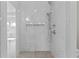 Elegant tiled shower with a rainfall shower head and a built-in niche for storage at 2485 Brooks Rd, Dacula, GA 30019