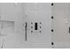 Contemporary walk-in shower featuring multiple showerheads and sleek black hardware at 2485 Brooks Rd, Dacula, GA 30019
