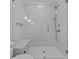 Modern shower stall with marble walls, a built-in bench, and sleek glass doors for a luxurious feel at 2485 Brooks Rd, Dacula, GA 30019