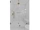 Modern shower with marble tiling, rainfall showerhead, and a built-in niche for storage at 2485 Brooks Rd, Dacula, GA 30019