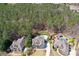 Stunning aerial view of neighborhood with a pool, beautiful homes and lush greenery, perfect for relaxation at 304 Gilmer Ct, Canton, GA 30115