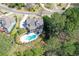 An aerial shot of a neighborhood featuring a luxury home with a gorgeous backyard and in-ground pool at 304 Gilmer Ct, Canton, GA 30115