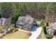Beautiful aerial view of a home showcasing the pool, expansive backyard, and lush surrounding greenery at 304 Gilmer Ct, Canton, GA 30115