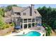 A refreshing pool, an expansive patio, and an outdoor seating, perfect for backyard relaxation at 304 Gilmer Ct, Canton, GA 30115