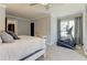 Bedroom features an exercise machine, desk, and a comfortable bed with access to an adjacent room at 304 Gilmer Ct, Canton, GA 30115