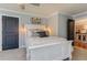 Bedroom features a comfortable bed, stylish decor, and access to another room through a black door at 304 Gilmer Ct, Canton, GA 30115